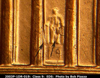 Die-stage A marker on 2003P•1DR•019 (2003 Doubled Die Reverse).