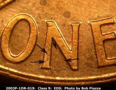 Die-stage A marker on 2003P•1DR•019 (2003 Doubled Die Reverse).