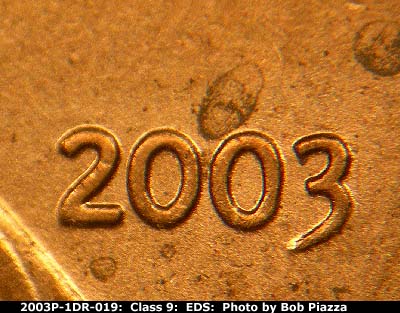 Die-stage A marker on 2003P•1DR•019 (2003 Doubled Die Reverse).