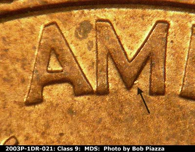Die-stage B marker on 2003P•1DR•021 (2003 Doubled Die Reverse).