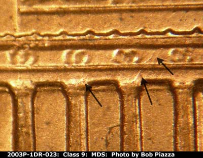 Die-stage B marker on 2003P•1DR•023 (2003 Doubled Die Reverse).
