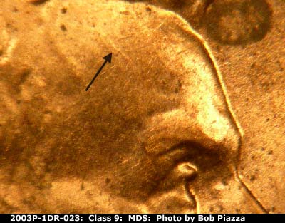 Die-stage B marker on 2003P•1DR•023 (2003 Doubled Die Reverse).