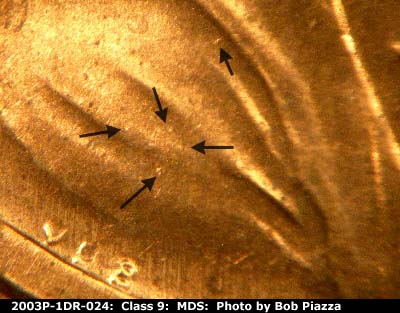 Die-stage B marker on 2003P•1DR•024 (2003 Doubled Die Reverse).
