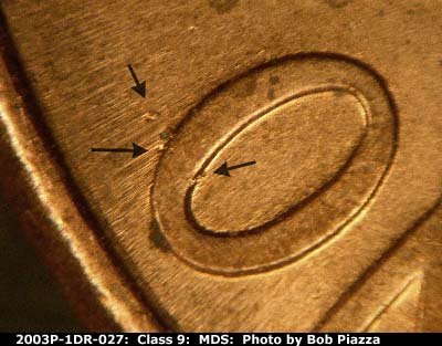 Die-stage B marker on 2003P•1DR•027 (2003 Doubled Die Reverse).