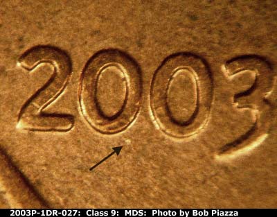 Die-stage B marker on 2003P•1DR•027 (2003 Doubled Die Reverse).