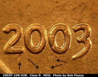 Die-stage B marker on 2003P•1DR•028 (2003 Doubled Die Reverse).