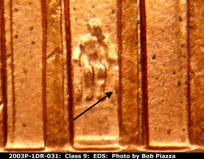 Die-stage A marker on 2003P•1DR•031 (2003 Doubled Die Reverse).