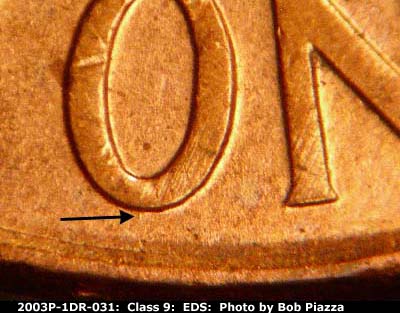 Die-stage A marker on 2003P•1DR•031 (2003 Doubled Die Reverse).