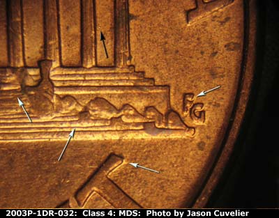 Die-stage B marker on 2003P•1DR•032 (2003 Doubled Die Reverse).