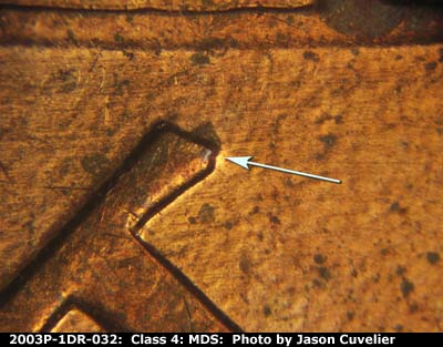 Die-stage B marker on 2003P•1DR•032 (2003 Doubled Die Reverse).