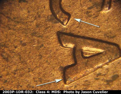 Die-stage B marker on 2003P•1DR•032 (2003 Doubled Die Reverse).