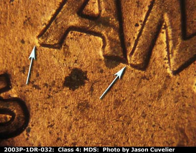 Die-stage B marker on 2003P•1DR•032 (2003 Doubled Die Reverse).