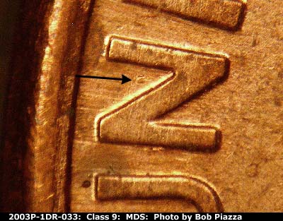 Die-stage B marker on 2003P•1DR•033 (2003 Doubled Die Reverse).