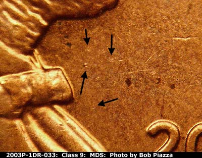 Die-stage B marker on 2003P•1DR•033 (2003 Doubled Die Reverse).