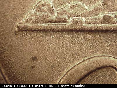 Die-stage B marker on 2004D•1DR•002 (2004 Doubled Die Reverse).