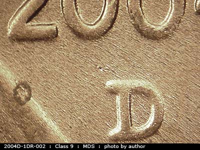 Die-stage B marker on 2004D•1DR•002 (2004 Doubled Die Reverse).