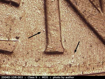 Die-stage B marker on 2004D•1DR•003 (2004 Doubled Die Reverse).