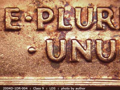 Die-stage C marker on 2004D•1DR•004 (2004 Doubled Die Reverse).