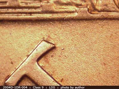 Die-stage C marker on 2004D•1DR•004 (2004 Doubled Die Reverse).