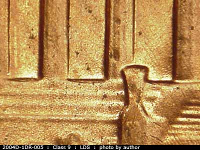 Die-stage C marker on 2004D•1DR•005 (2004 Doubled Die Reverse).