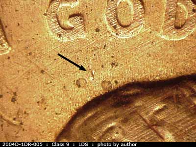 Die-stage C marker on 2004D•1DR•005 (2004 Doubled Die Reverse).