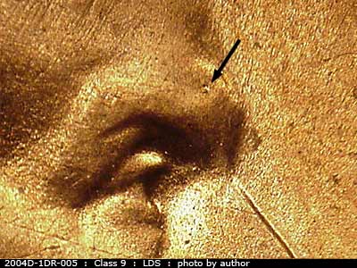 Die-stage C marker on 2004D•1DR•005 (2004 Doubled Die Reverse).