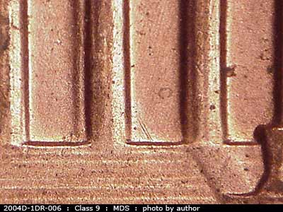 Die-stage B marker on 2004D•1DR•006 (2004 Doubled Die Reverse).