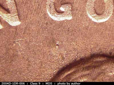 Die-stage B marker on 2004D•1DR•006 (2004 Doubled Die Reverse).