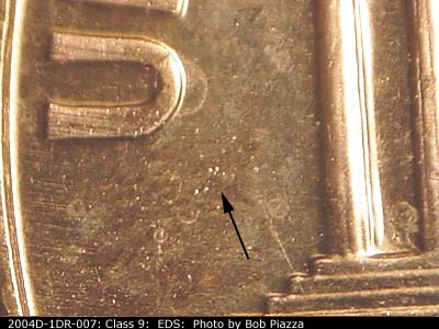 Die-stage A marker on 2004D•1DR•007 (2004 Doubled Die Reverse).