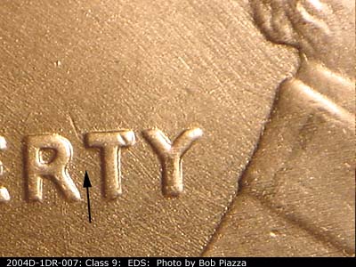 Die-stage A marker on 2004D•1DR•007 (2004 Doubled Die Reverse).