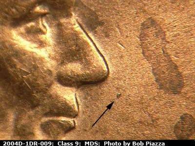 Die-stage B marker on 2004D•1DR•009 (2004 Doubled Die Reverse).