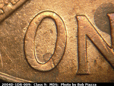 Die-stage B marker on 2004D•1DR•009 (2004 Doubled Die Reverse).