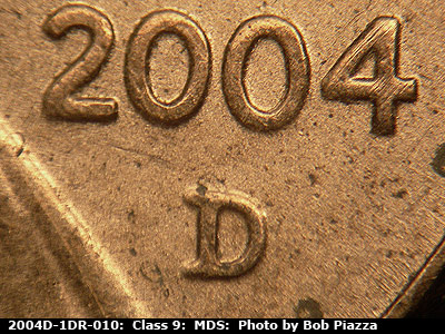 Die-stage B marker on 2004D•1DR•010 (2004 Doubled Die Reverse).