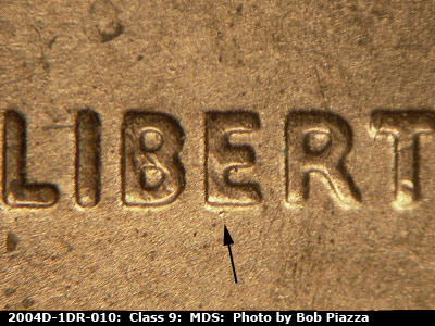 Die-stage B marker on 2004D•1DR•010 (2004 Doubled Die Reverse).