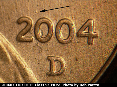 Die-stage B marker on 2004D•1DR•011 (2004 Doubled Die Reverse).