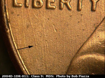 Die-stage B marker on 2004D•1DR•011 (2004 Doubled Die Reverse).