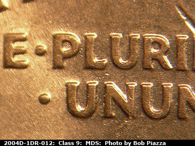 Die-stage B marker on 2004D•1DR•012 (2004 Doubled Die Reverse).