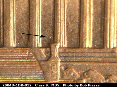 Die-stage B marker on 2004D•1DR•012 (2004 Doubled Die Reverse).