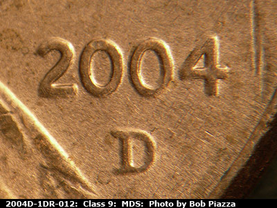 Die-stage B marker on 2004D•1DR•012 (2004 Doubled Die Reverse).