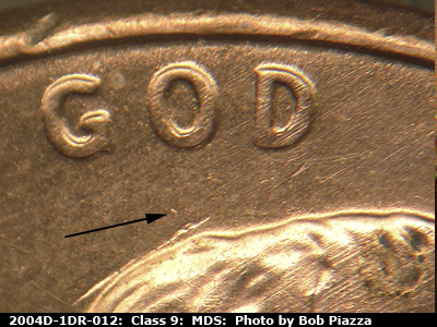 Die-stage B marker on 2004D•1DR•012 (2004 Doubled Die Reverse).