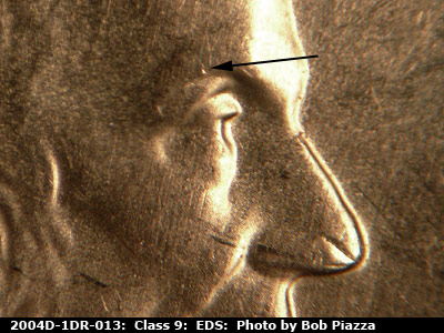 Die-stage A marker on 2004D•1DR•013 (2004 Doubled Die Reverse).