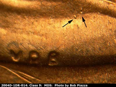 Die-stage B marker on 2004D•1DR•014 (2004 Doubled Die Reverse).