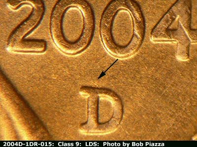 Die-stage C marker on 2004D•1DR•015 (2004 Doubled Die Reverse).