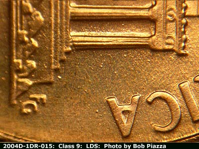 Die-stage C marker on 2004D•1DR•015 (2004 Doubled Die Reverse).