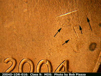 Die-stage B marker on 2004D•1DR•016 (2004 Doubled Die Reverse).