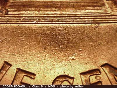 Die-stage B marker on 2004P•1DO•001 (2004 Doubled Die Obverse).