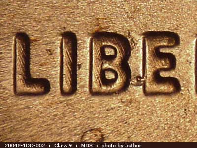 Die-stage B marker on 2004P•1DO•002 (2004 Doubled Die Obverse).