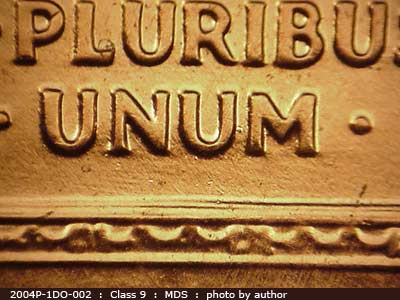 Die-stage B marker on 2004P•1DO•002 (2004 Doubled Die Obverse).