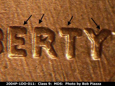 Die-stage B marker on 2004P•1DO•011 (2004 Doubled Die Obverse).