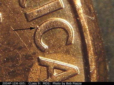 Die-stage B marker on 2004P•1DR•005 (2004 Doubled Die Reverse).